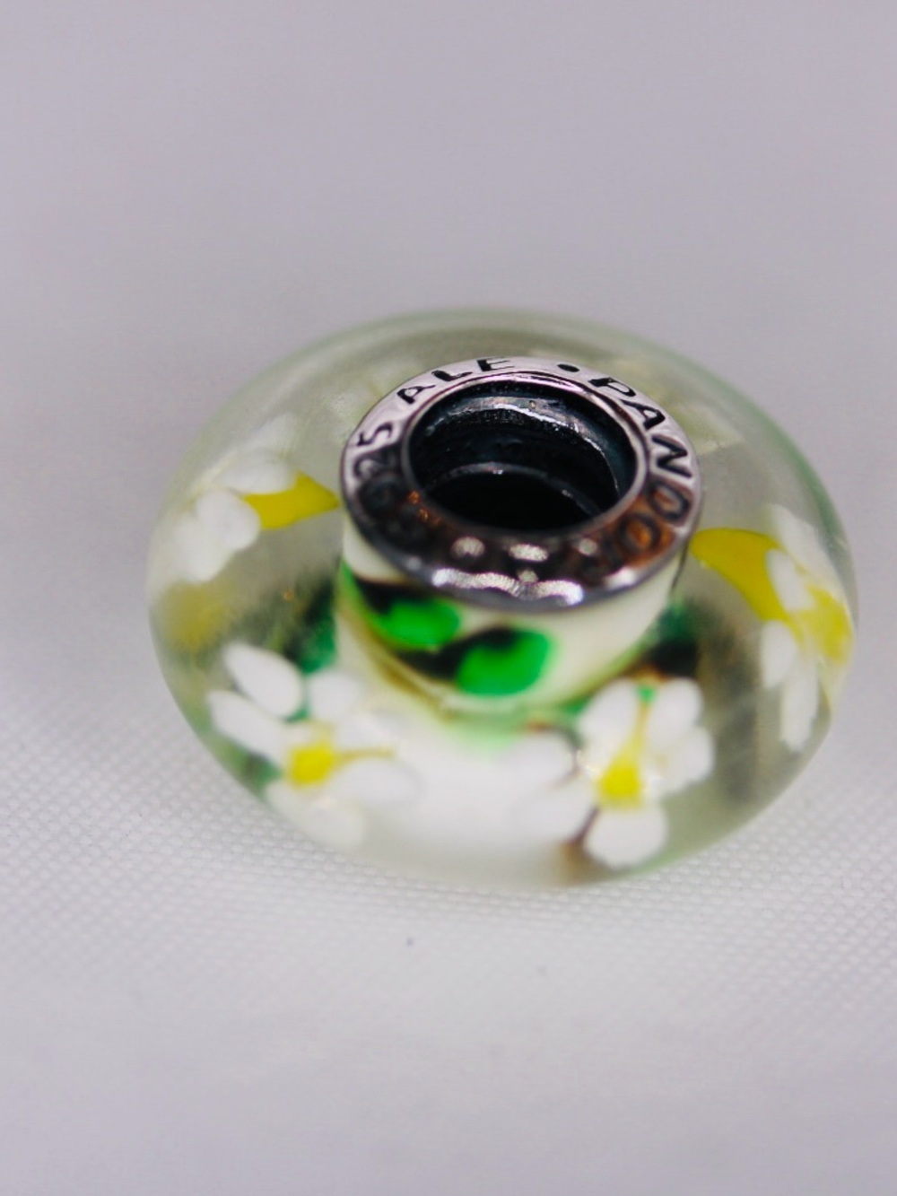 Like new Pandora  white green and yellow floral glass Murano charm